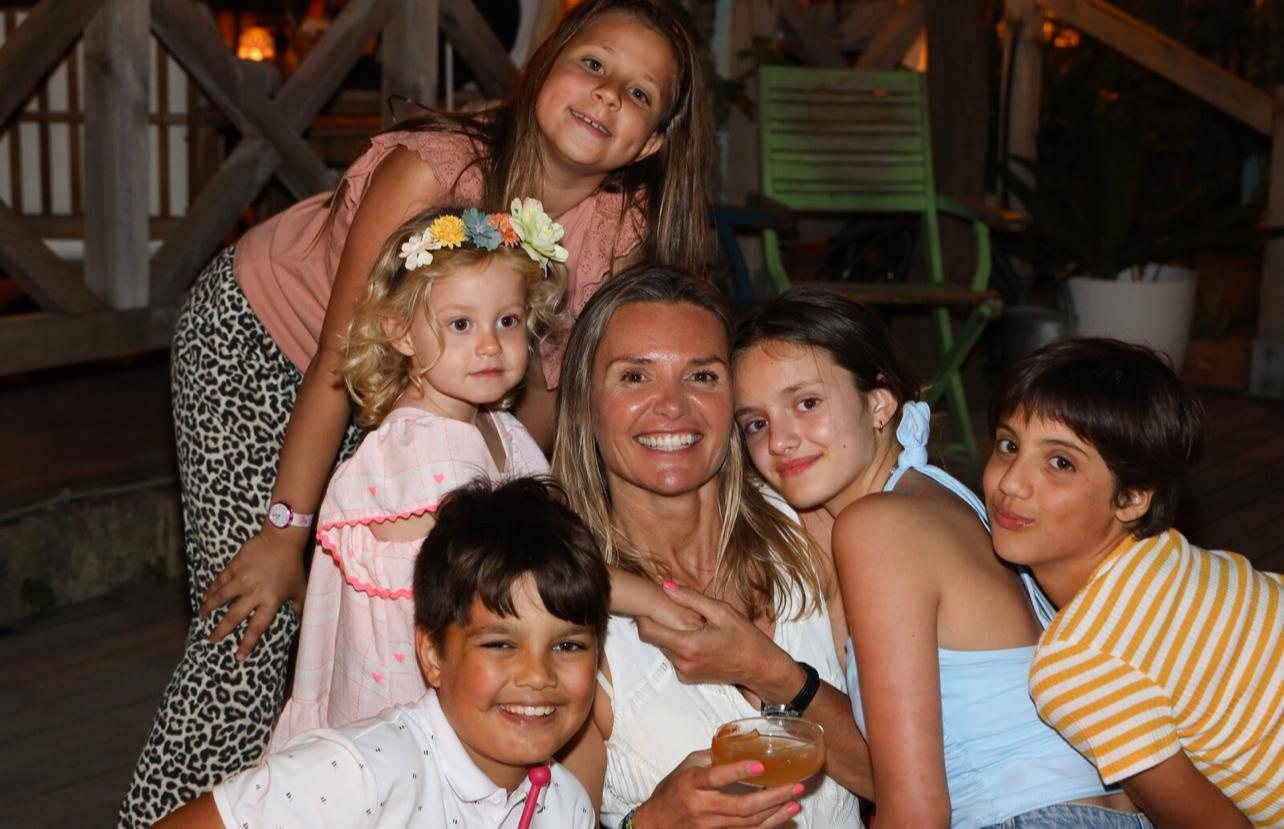 A family celebrating in the evening at Kalima Beach