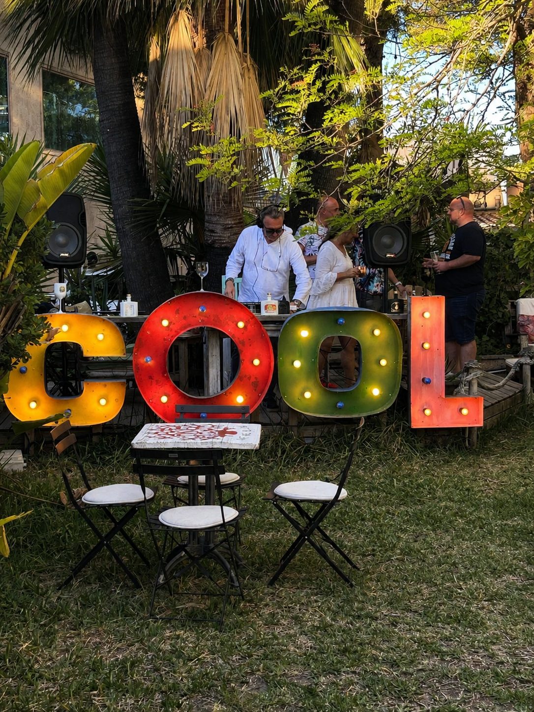 Garden bar with playful COOL letter lights