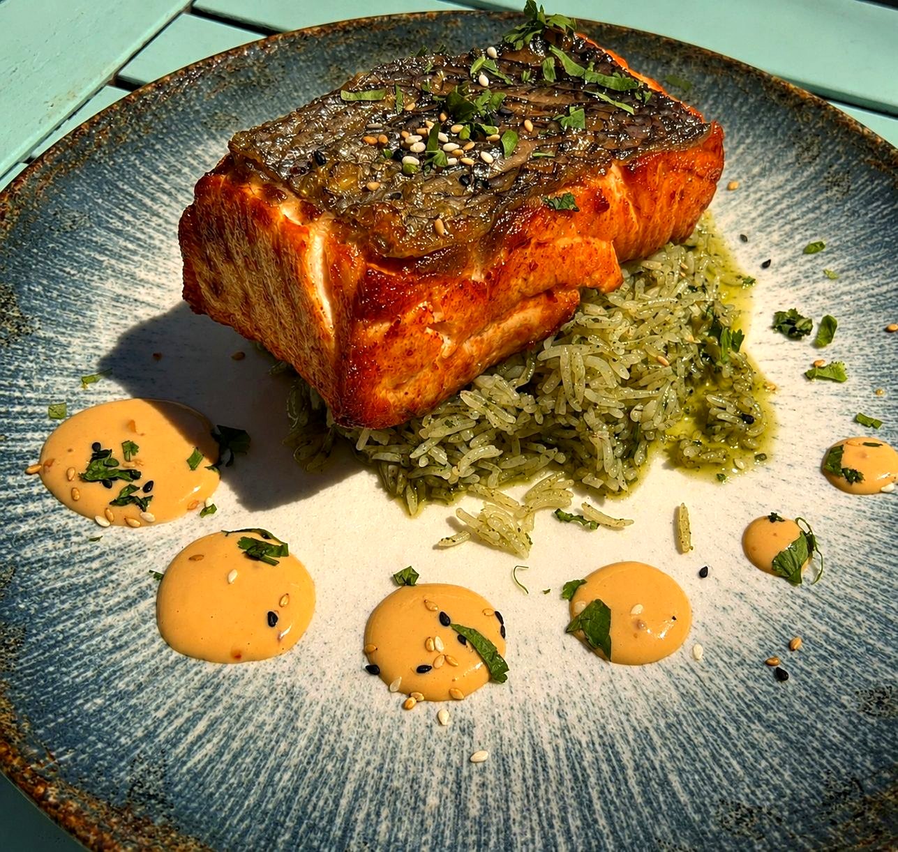 Grilled salmon on green rice